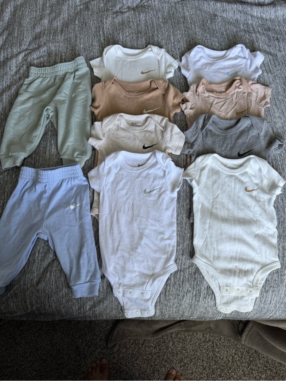 Nike White Baby Onesie with Gray Swoosh